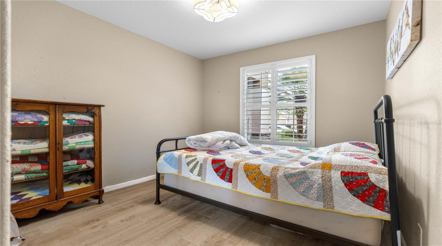 Guest Bedroom Tile Flooring, Plantation Shutters, High Ceiling