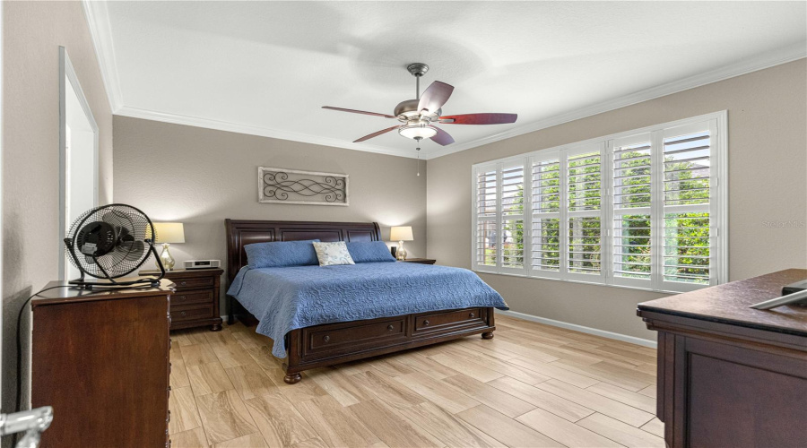 Spacious Primary Bedroom Natural Lighting From Large Windows