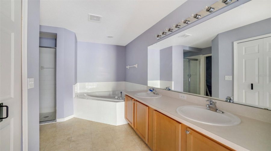 The Garden Tub In The Primary En Suite Bathroom Provides The Perfect Place To Relax And Recharge After A Long Day.