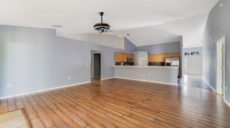 The Open Connection Between The Kitchen And Family Room Creates A Welcoming Space Perfect For Hosting Gatherings Or Enjoying Family Time.