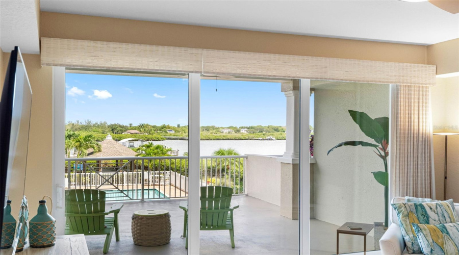 ... Water View From  Living Area.. Custom  Light Filtering Drapes... Note: The Master Suite Has Custom Black - Out Curtains.