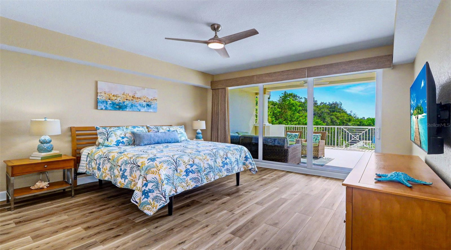 ... Master Suite - Triple High Impact Sliders Can Recess Back To 8 Foot Opening. New Flooring, New Fan , New Wall Finish Plus New  Custom  2 Way  Floor To Ceiling Woven  Wood Black Out Drapes.