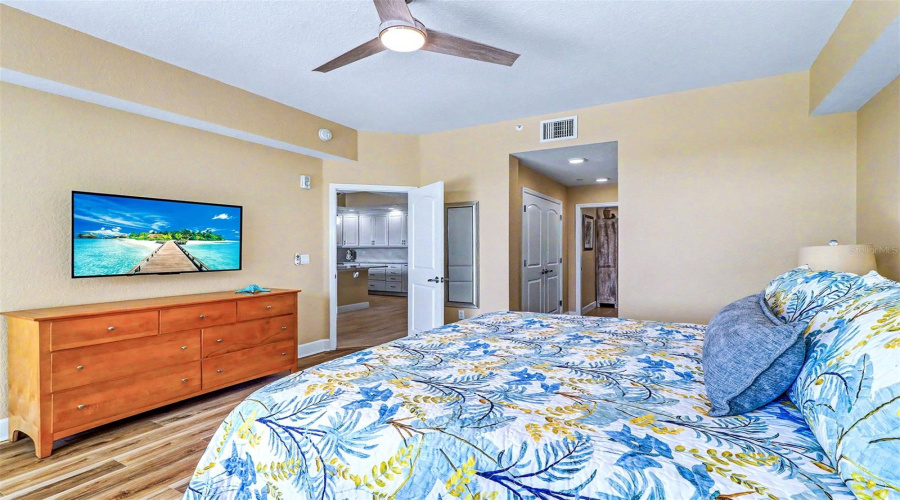 ..Master Suite Looking Out Towards Living Room Area And Kitchen.