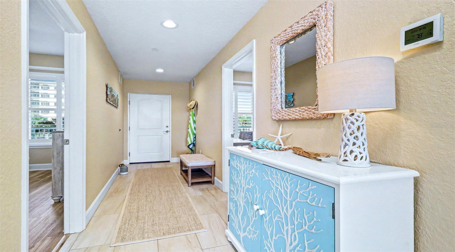..Entrance Door ( 2 Panel Solid Core White ). Owners Changed Out The Entire Frame &Amp; Installed A Fiberglass Door Plus Added A Storm Door With A Drop Down Recessed Screen. Guest Bedroom On Left Has Jack &Amp; Jill Door To Hall Bathroom. Guest Bedroom On Right Set Up As An Office / Bedroom ..