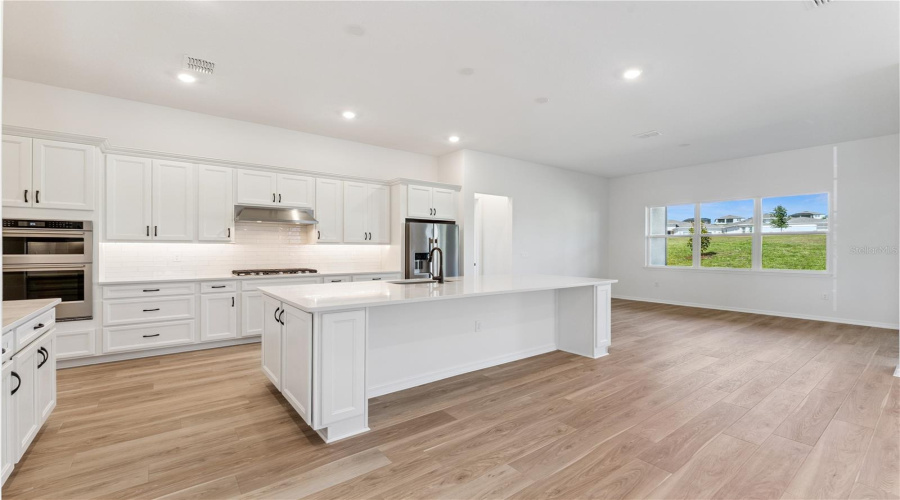 Gourmet Kitchen With Adjacent Dinning Area Featuring Beautiful View-Light And Bright!