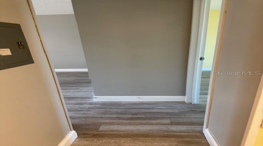 Hall Way From Kitchen To Living Room On The Left And Entry To Master Bedroom