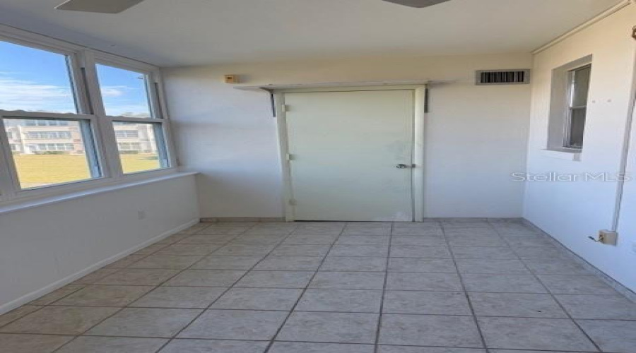 Florida Room - Door Leads To Storage Room