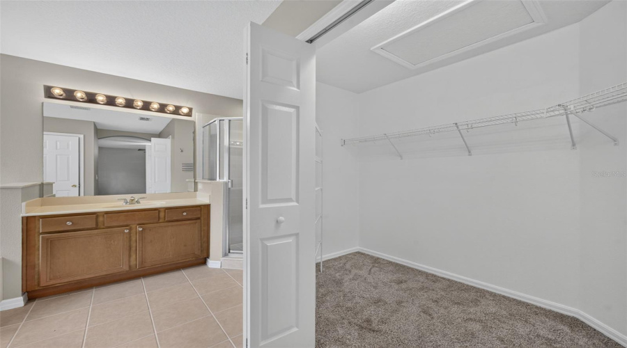 Primary Bathroom And Walk-In Closet