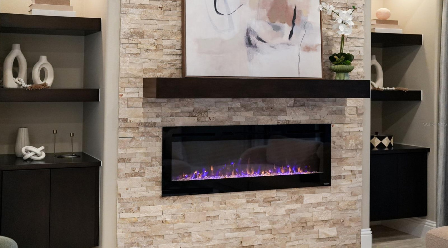 Renovated Lakewood Country Club Home With Accent Wall Featuring Electric Fireplace And Stone Hearth