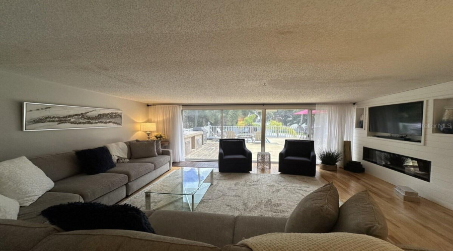 Living Area With Patio Doors To Large Patio Area.