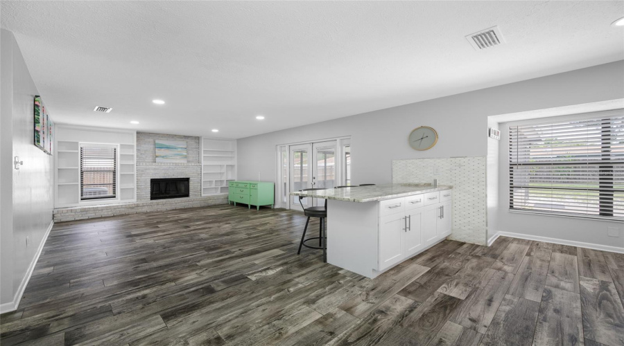 Family Room With Fireplace And Kitchen Breakfast Bar