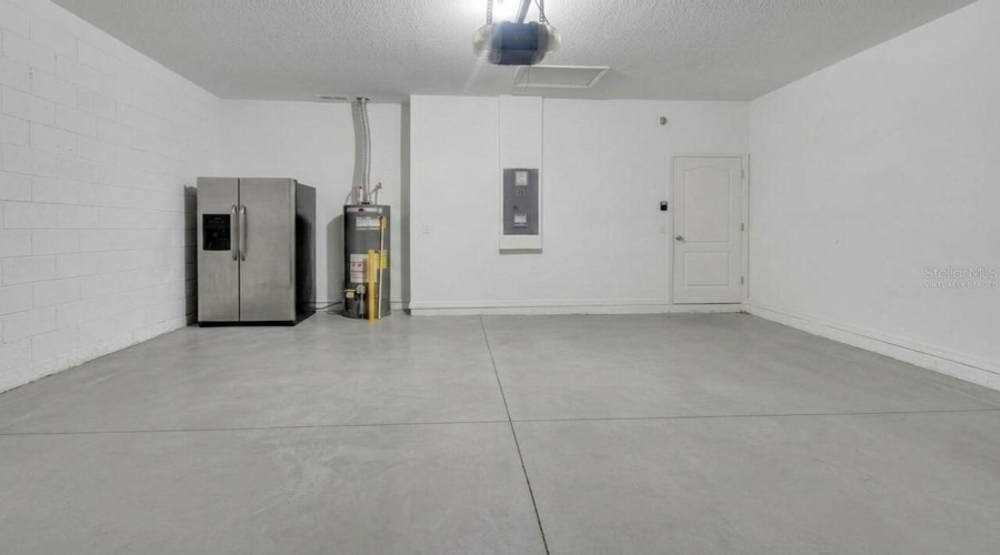 Virtually Staged And Garage Fridge Does Not Convey.