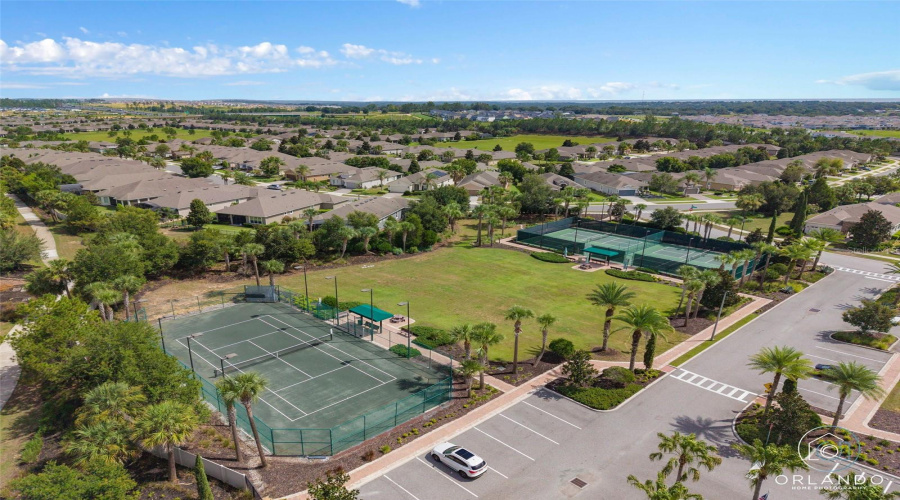 Clay Tennis Court. The Court Is Lighted For Nighttime Play.