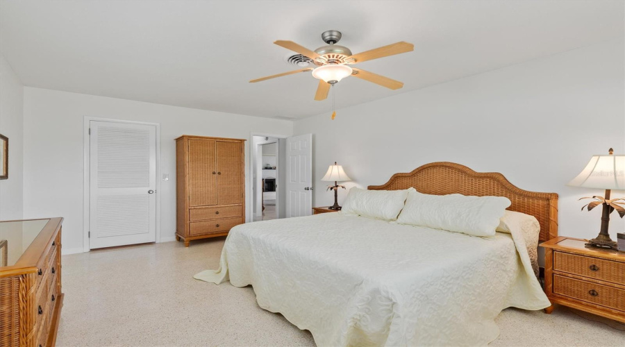 Primary Bedroom With Walk In Closet (Closed Door)- Open Door To Hallway