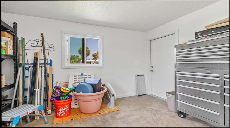 1/2 View Of Storage Room Just Off Family Room-Has Hurricane Windows-Great Option To Add Split Ac Make Additional Room