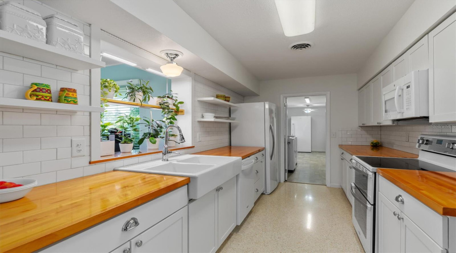 Kitchen View Looking Towards Large Laundry Room