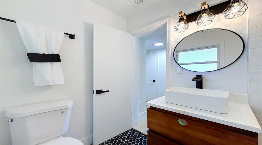 Fresh And Modern Bathroom With Stylish Black Fixtures.