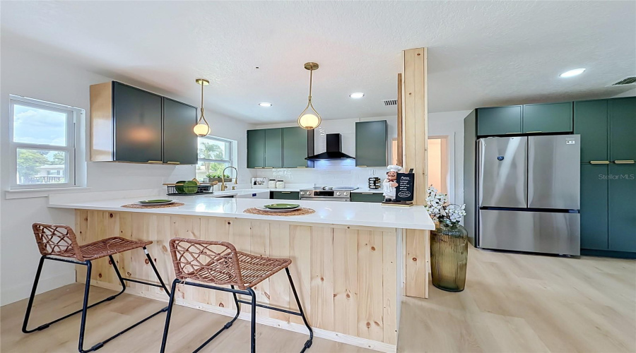 Large Kitchen Peninsula With Seating And Plenty Of Storage.
