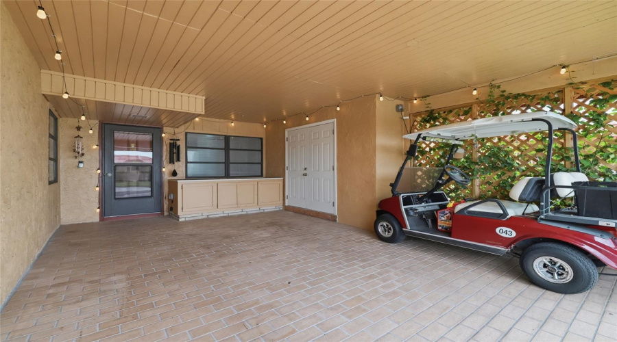 Carport With Workbench And Storage