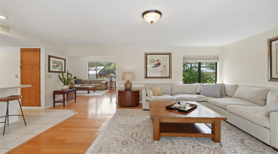 This Versatile Open Room Could Serve As A Dining Area Or Additional Living Space