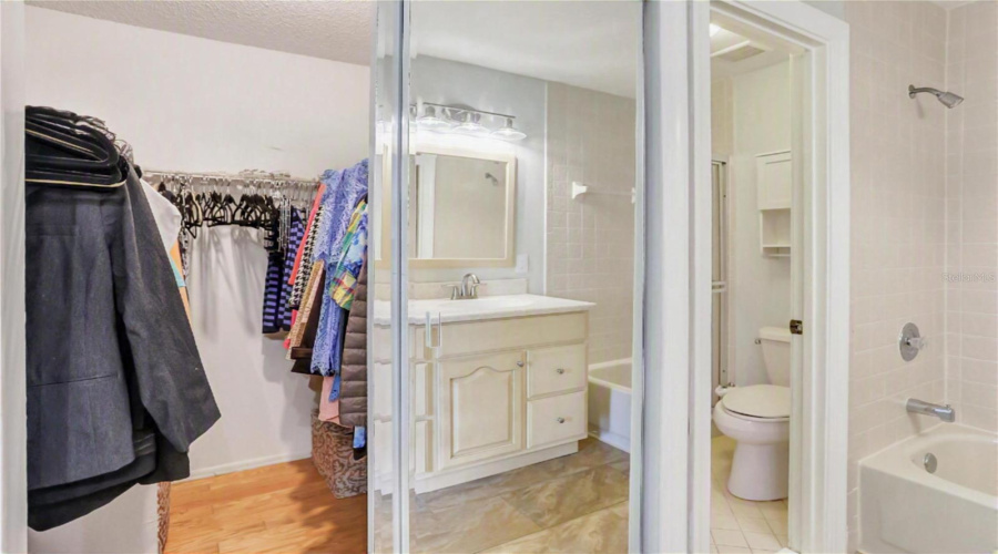 Primary Walk In Closet And Separate Room With Walk-In Shower.