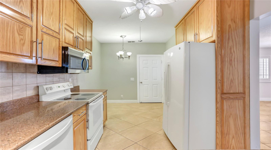 Custom Cabinetry And Eating Space In The Kitchen.