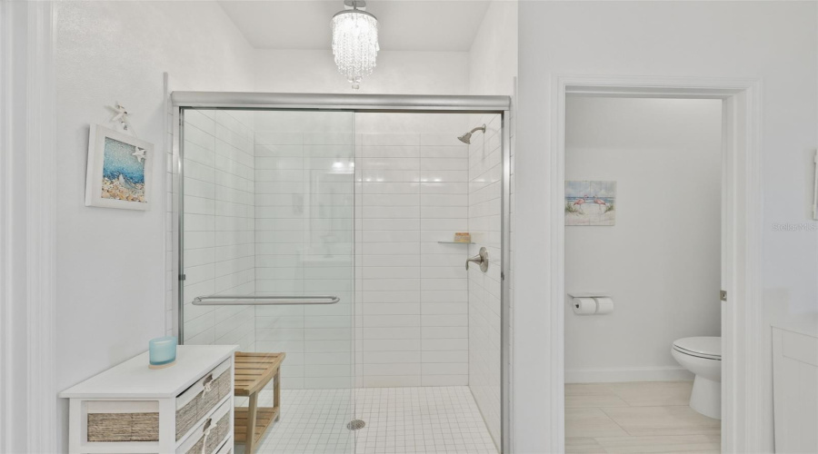 Primary Ensuite Bathroom With Crystal Chandelier