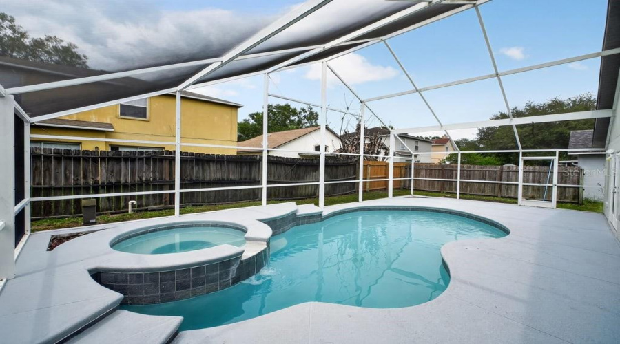 Alternate View Of The Screened Lanai Featuring The Pool And Spa.