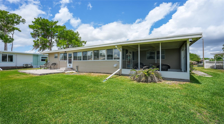 Featuring A Covered Screened Porch And An Open Patio