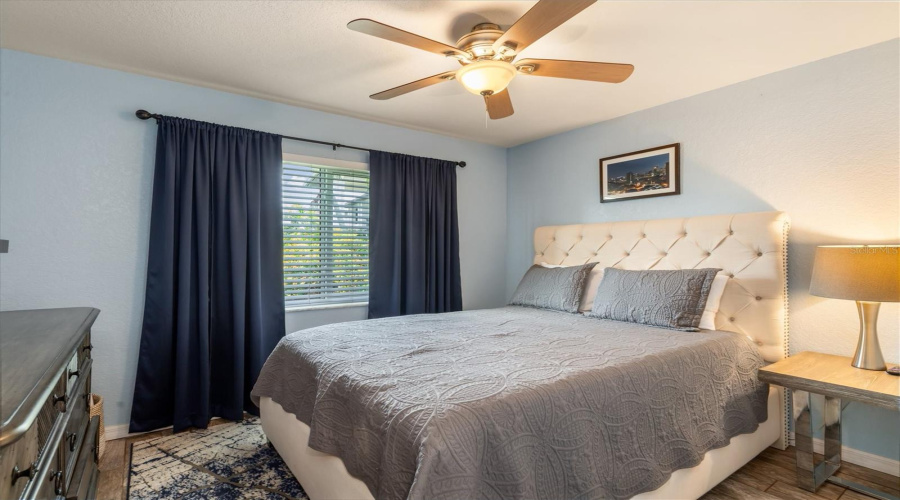 Guest Bedroom With Lush Landscape View.