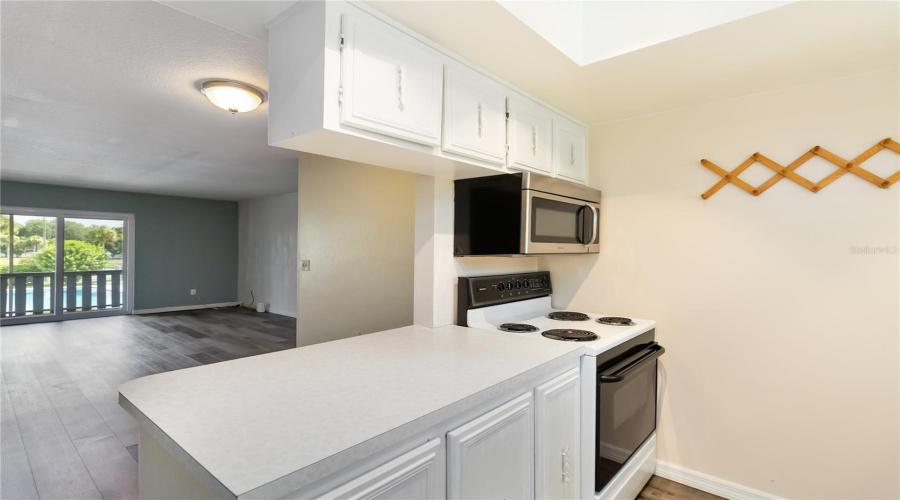 Kitchen With Peninsula To Open Concept