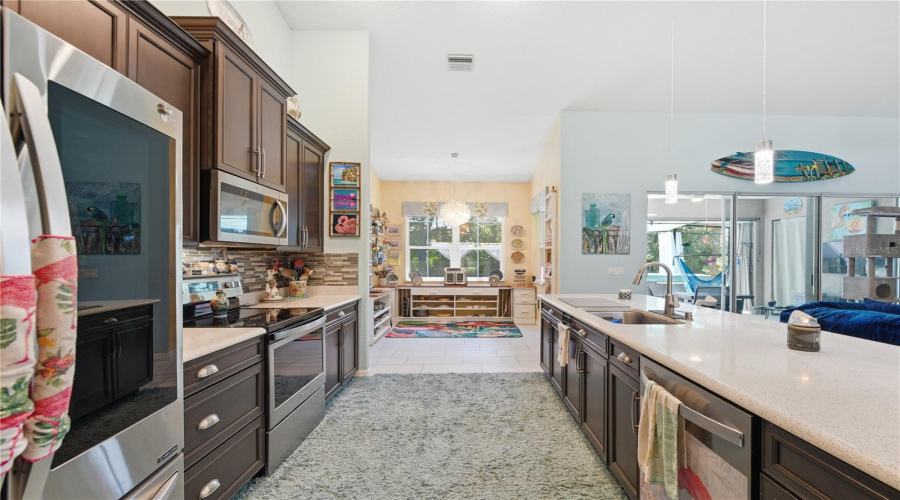 Kitchen With Quartz Countertops And 42-Inch Cabinets.