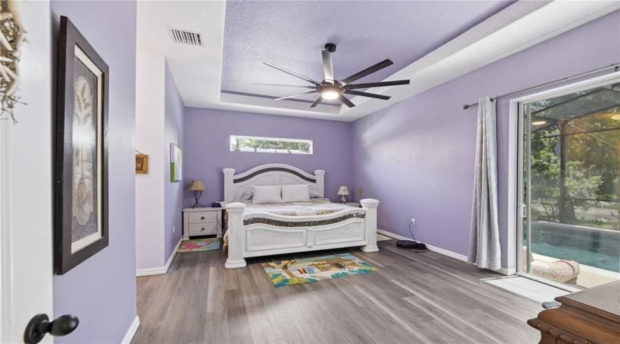Main Bedroom With A Tinted Sliding Door That Takes You Out To The Pool. The Window Over The Bed Lets In Lots Of Light.