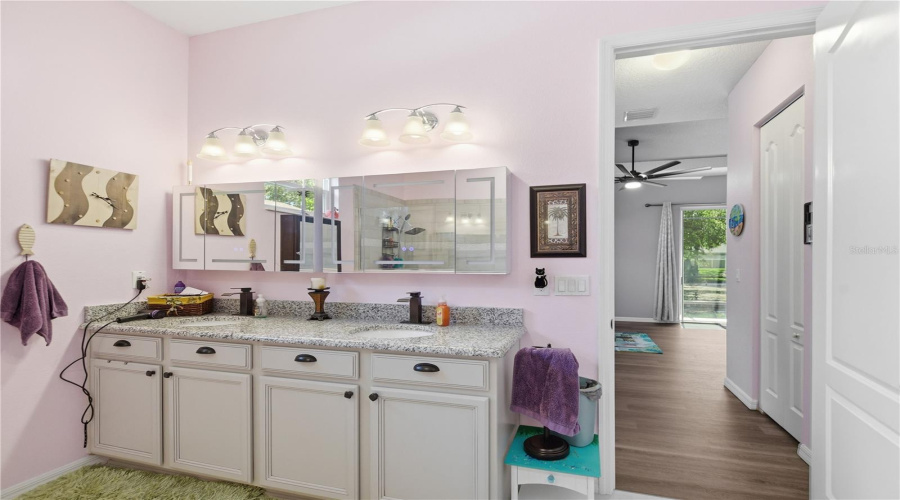 Main Bath With Double Sinks And Granite Countertops.