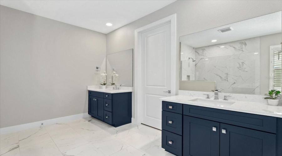 Primary Bathroom With Walk-In Closet And Linen Closet
