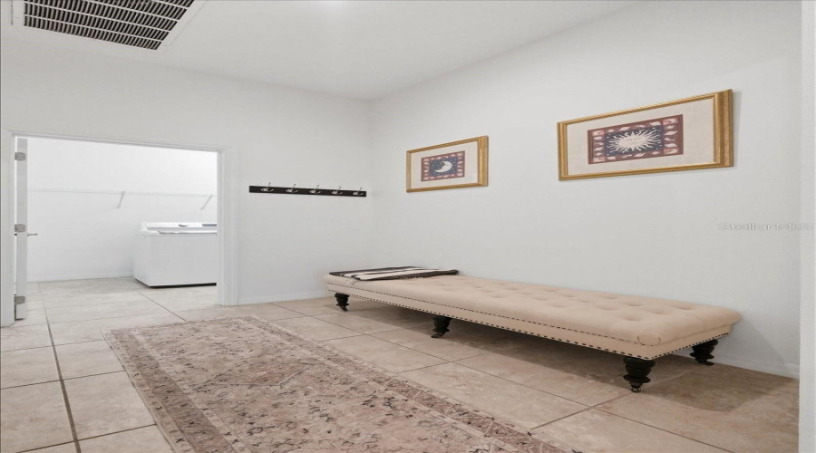 A Thoughtfully Designed Mudroom Just Off The Garage Welcomes You Home, With The Laundry Room To One Side And Direct Access Into The Heart Of The Home On The Other.
