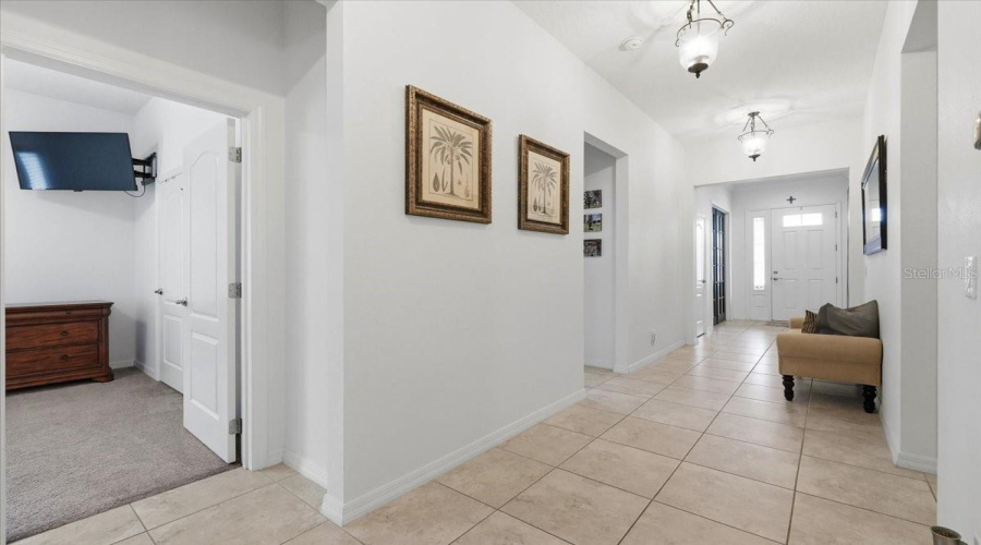 A Remarkably Wide Hallway Offers An Airy Sense Of Openness And Easy Flow Throughout The Home.