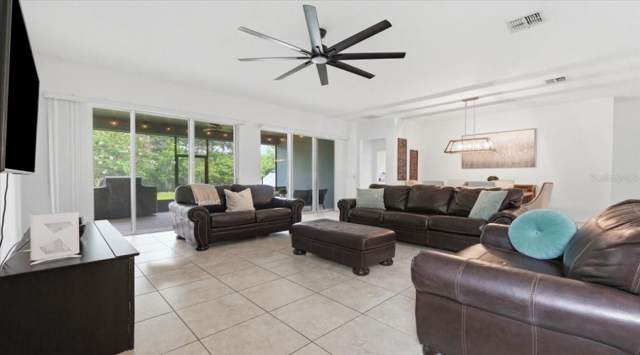 Designed For Gathering, Relaxing And Staying Connected, This Expansive Living Space Flows Effortlessly Toward The Outdoors And The Peaceful Greenery Beyond.