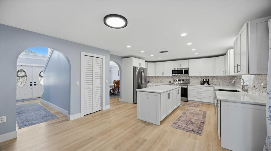 Recessed Lighting, Arched Doorways And Extra Large Drawer Storage In Lower Kitchen Cabinets