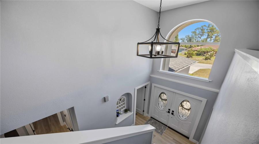 Upstairs Hallway Showing Vaulted Ceiling From The Foyer