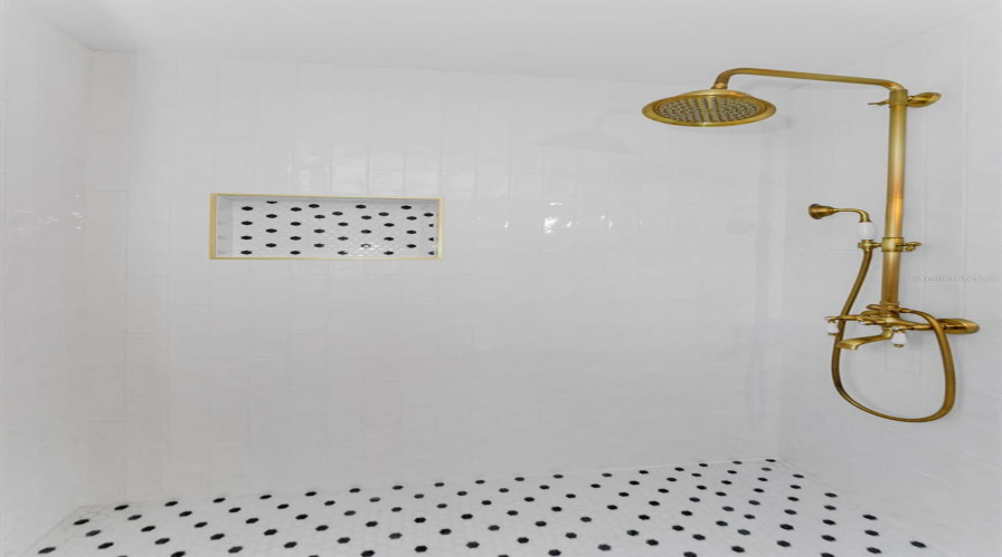 Vintage Inspired Tile With Antique Brass Shower Fixtures