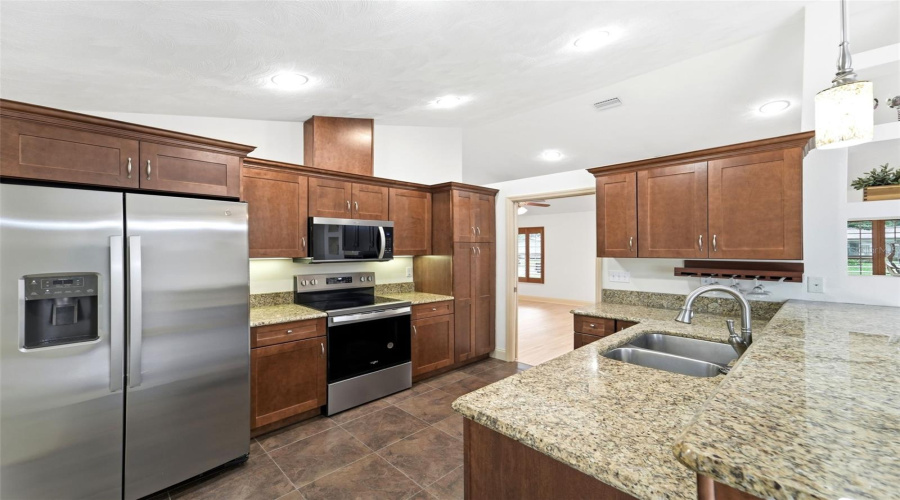 The Heart Of The Home Features Generous Workspace And Seamless Flow Into The Living Areas.