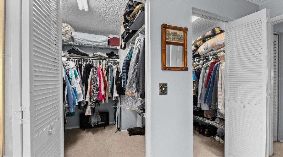 Generous Walk-In Closet Provides Valuable Storage Space.