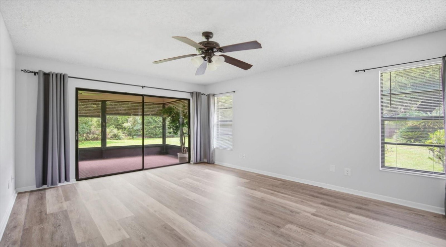 Primary Bedroom With Sliding Glass Doors To Lanai
