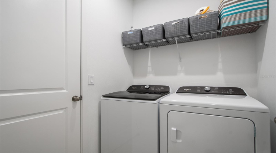 In The Same Hallway As Bedroom 4 And Bathroom 3 Is The Laundry Room Complete With Washer And Dryer Hook Up And Shelving For Laundry Essentials.