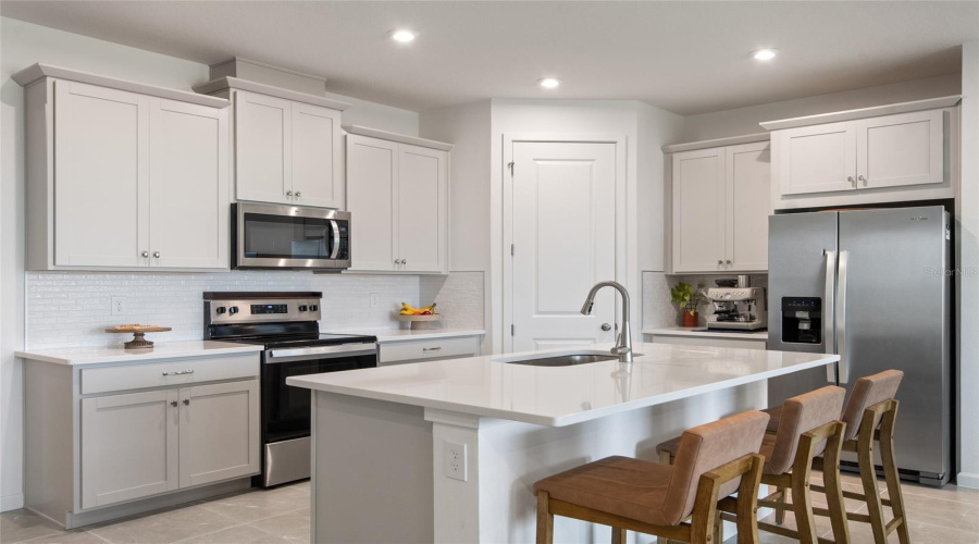 Variable Height Cabinets, Quartz Counterops, Stainless Steel Sink And Upgraded Pull Down Faucet Are Appreciated.