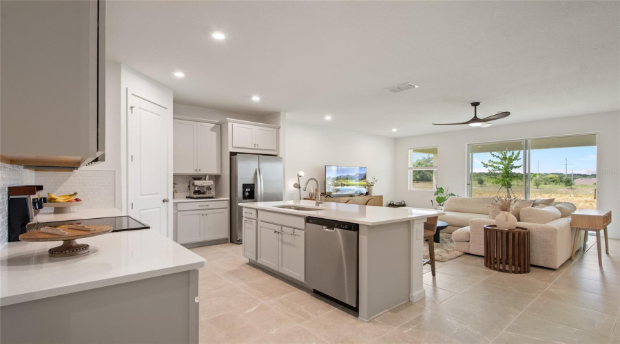 Kitchen Island With Breakfast Bar That Seats 3 Or 4 Depending On Stool Dimensions, Built In Dishwasher In The Island To Allow 2 Chefs To Work Easily One At The Range And One At The Sink Prepping Vegetables While The Other Handles The Sauce Pan On Low.