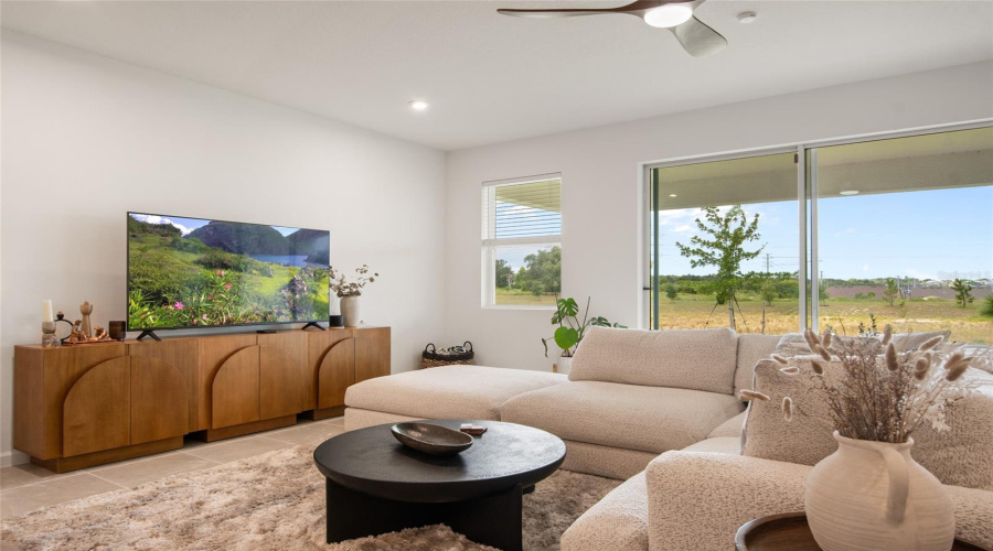 Natural Light Abounds In The Great Room With Immediate Access To The Covered Porch, Sunset And No Rear Neighbors.