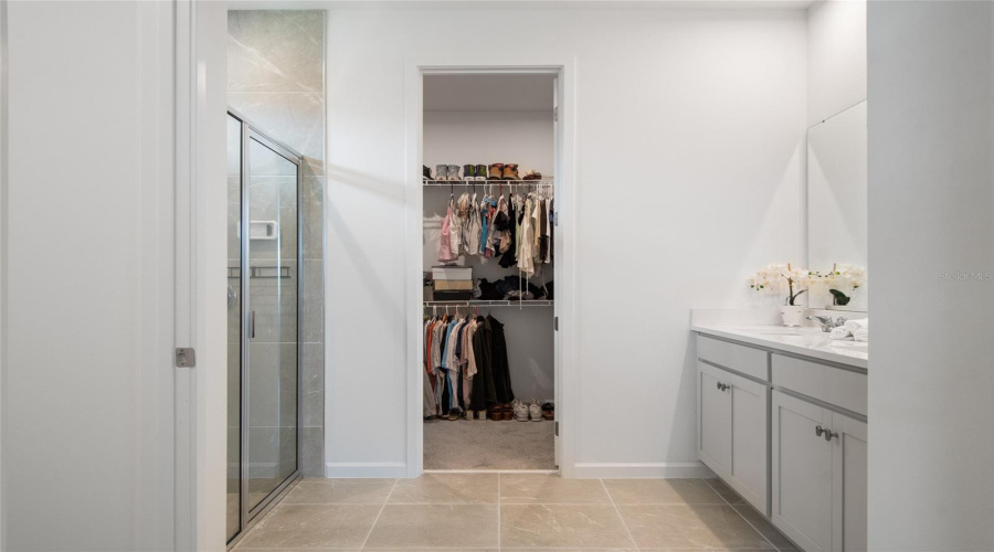 Upon Entering You Realize The Primary Bathroom Is Expansive. A Double Vanity With Storage, Walk In Shower And Huge Walk In Closet At The End Of The Bathroom.