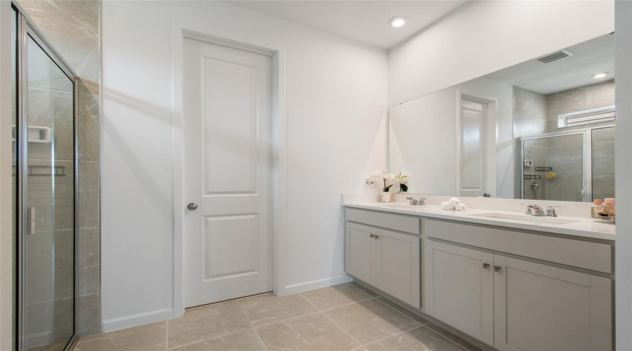 Ample Space To Move Around The Whole Family Could Get Together In This Primary Bathroom.